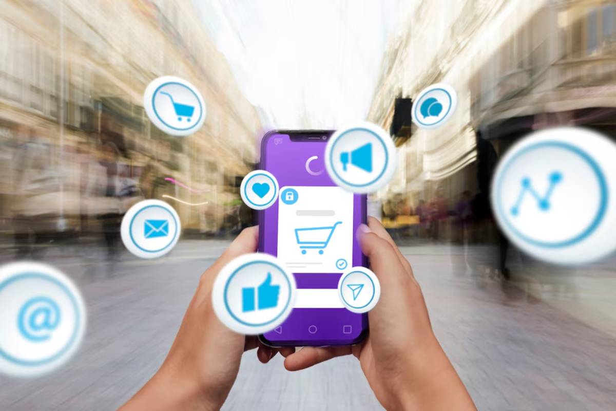 Hands holding a smartphone displaying various app icons superimposed on a blurred urban background.